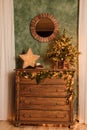 Antique wooden brown chest of drawers with Christmas decor Royalty Free Stock Photo