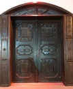 Antique wooden carved brown double door close-up Royalty Free Stock Photo