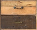 An antique wooden chest of drawers with metal handles, different kind old wooden boxes Royalty Free Stock Photo