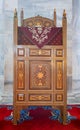 Antique wooden decorated high bench for reading Quran, at Ottoman Fatih Mosque, Istanbul, Turkey