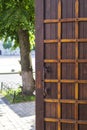 Antique wooden door with metal plates and handles Royalty Free Stock Photo