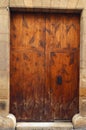 Antique wooden door with wrought iron handle, old wood texture, Royalty Free Stock Photo