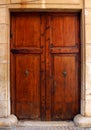 Antique wooden door with wrought iron handle, old wood texture Royalty Free Stock Photo