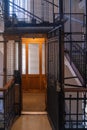 Antique wooden Elevator in a Metal Shaft Royalty Free Stock Photo