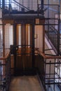 Antique wooden Elevator in a Metal Shaft Royalty Free Stock Photo