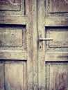 An old door with cracked paint on it. Royalty Free Stock Photo