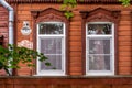 Antique wooden house in Old Town city. wooden house with beautiful carved platbands Royalty Free Stock Photo