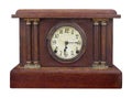 Antique wooden mantel clock isolated.