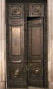 Antique wooden massive half opened door with carved wooden ornament Royalty Free Stock Photo