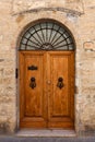 Antique wooden door San Gimignano, Siena, Tuscany, Italy Royalty Free Stock Photo