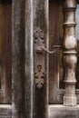 Antique wooden ornamental door with elegant iron handle Royalty Free Stock Photo