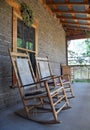 Antique wooden rocking chair on farmhouse porch Royalty Free Stock Photo