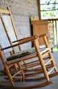 Antique wooden rocking chair on farmhouse porch Royalty Free Stock Photo