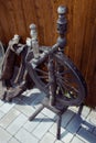 Antique wooden spinning wheel. Country style. Threads, yarns Royalty Free Stock Photo