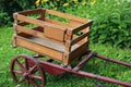 Antique Wooden Trolley with Red Wheels Royalty Free Stock Photo