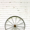 Antique Wooden Wagon Wheel on Rustic White Background Royalty Free Stock Photo