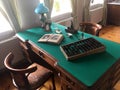 Antique working Desk with a lamp, books, documents, accounts