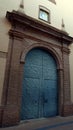 An antique wrought iron door to a church