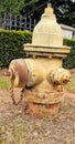 Antique yellow fire hydrant Royalty Free Stock Photo