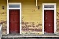 Antique yellow house duplex red doors