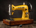Antique Yellow Sewing Machine Ã¢â¬\' Vintage Tailoring Tool for Retro Decor generative ai Royalty Free Stock Photo