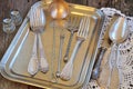 Antiques - cutlery, spoons, forks, knives on a tray Royalty Free Stock Photo