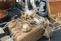 Antiques on flea market or festival - close up view of vintage jewelry, silver brooches and other vintage things