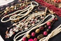 Antiques at flea market or garage sale - vintage jewelry, retro pearl necklace and other vintage things Royalty Free Stock Photo