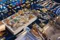 Antiques on flea market or seasonal festival - vintage jewelry, silver brooches and other vintage things. Collectibles