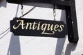 Antiques sign on wall, Tewkesbury.