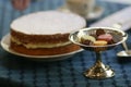 Antiques silver candy pedestal and sponge cake stillife Royalty Free Stock Photo