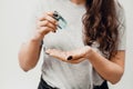 Antiseptic is squeezed out on the hands. COVID-19 Close up woman hands using wash hand sanitizer gel dispenser, against Novel Royalty Free Stock Photo