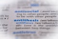 Antithesis word in a dictionary. Selective focus, close up Royalty Free Stock Photo