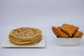 Mandazi and Chapati on the plates and on the floor and spoons in Nairobi Kenya East African