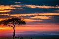 Magical Lone Trees Sunset Gazelle Antelope grazing grassland savannah in the Maasai Mara National Game Reserve park rift valley Na Royalty Free Stock Photo