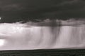 Dramatic clouds sun rays light burst black and white on the savannah grasslands at the Maasai Mara National Game Reserve Park And Royalty Free Stock Photo