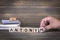 Antonym. wooden letters on the office desk Royalty Free Stock Photo