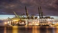 Illuminated container terminal at night, Port of Antwerp, Belgium