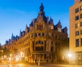 Antwerp, Belgium - August 06, 2022: Baroque buildings and statue of David Teniers the Younger on Leysstraat