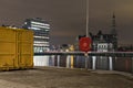 Antwerp, Belgium - February 5, 2020: A life buoy with the loodswezen - pilotage - building in the background Royalty Free Stock Photo