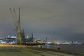 Antwerp, Belgium - February 5, 2020: Skyline of Antwerp with old harbor cranes in the front