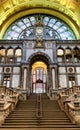 Antwerp, Belgium - June 2019: Interior of Antwerp Central Train station with sun shining through the glass windows