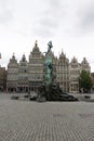 Statue of Brabo and the giant`s hand with 16th-century Guildhouses at the Grote Markt in Antwerp Royalty Free Stock Photo