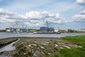 Antwerp, Belgium - JView over the green banks of the River Scheldt and the industrial installation of the Equans construction