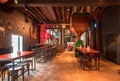 Interior of empty bar with tables inside historical brewery with trademark De Koninck Royalty Free Stock Photo