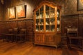 Porcelain set on shelves of antique cupboard in printing museum of Plantin-Moretus, UNESCO World Heritage Site Royalty Free Stock Photo