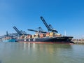 Antwerp, Belgium Panoramic view of harbor cranes and container ships in the largest dock of the port of Antwerp Royalty Free Stock Photo