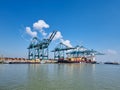 Antwerp, Belgium Panoramic view of harbor cranes and container ships in the largest dock of the port of Antwerp Royalty Free Stock Photo