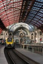 2018-10-01 Antwerp, Belgium: Platforms and train hall with iron and glass vaulted ceiling of Antwerp Central Station.