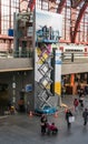 Antwerp, Belgium - 2018-10-01: Replacing a poster on the lift hoistway hig above the ground. Royalty Free Stock Photo